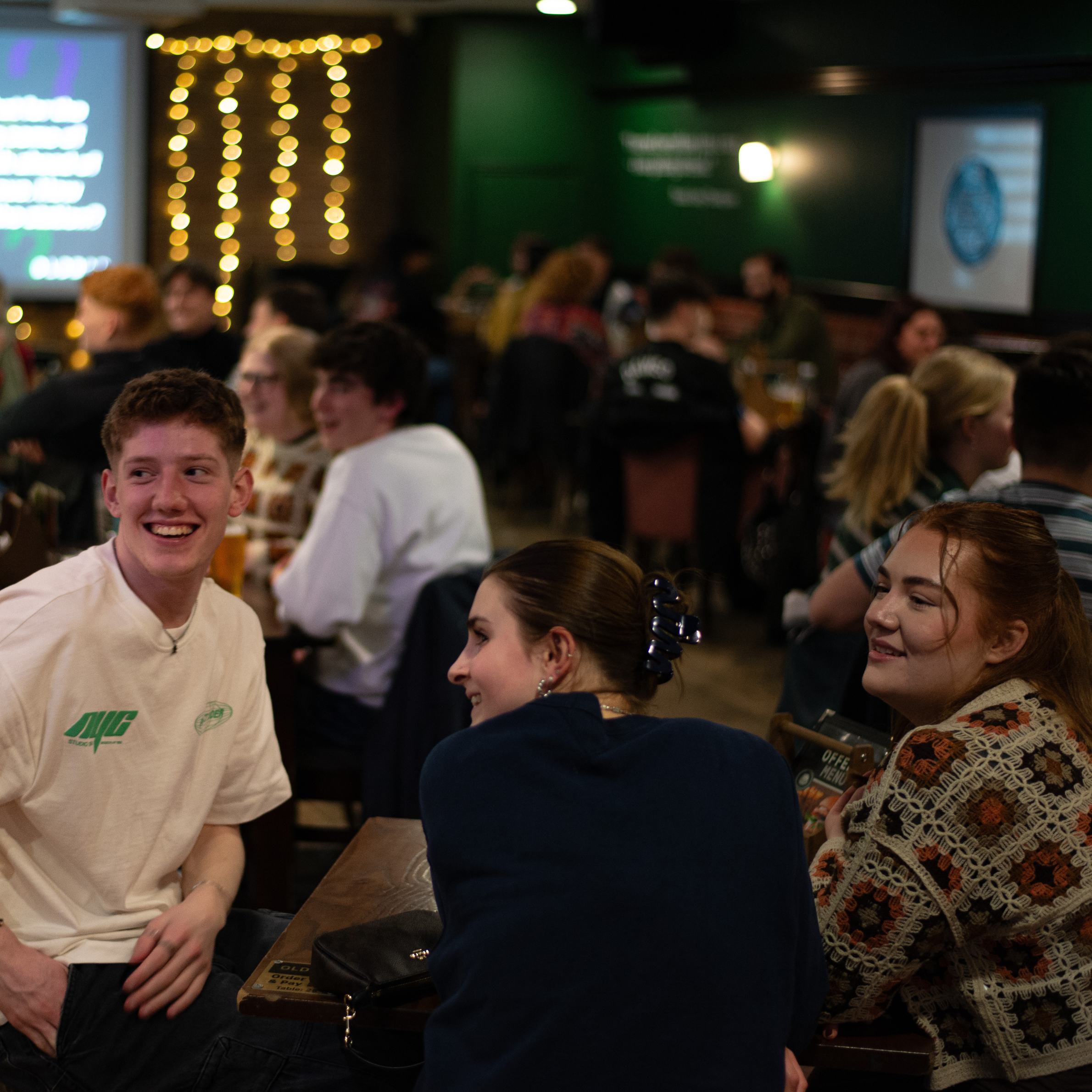 Image of a group of people smiling in Old Bar.